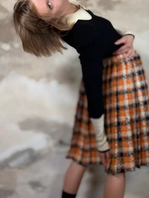 Black sweater with white collar