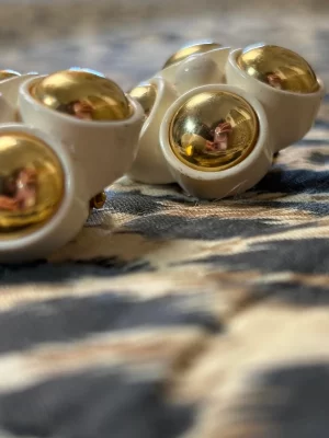 White wooden clip-on earrings with gold beads